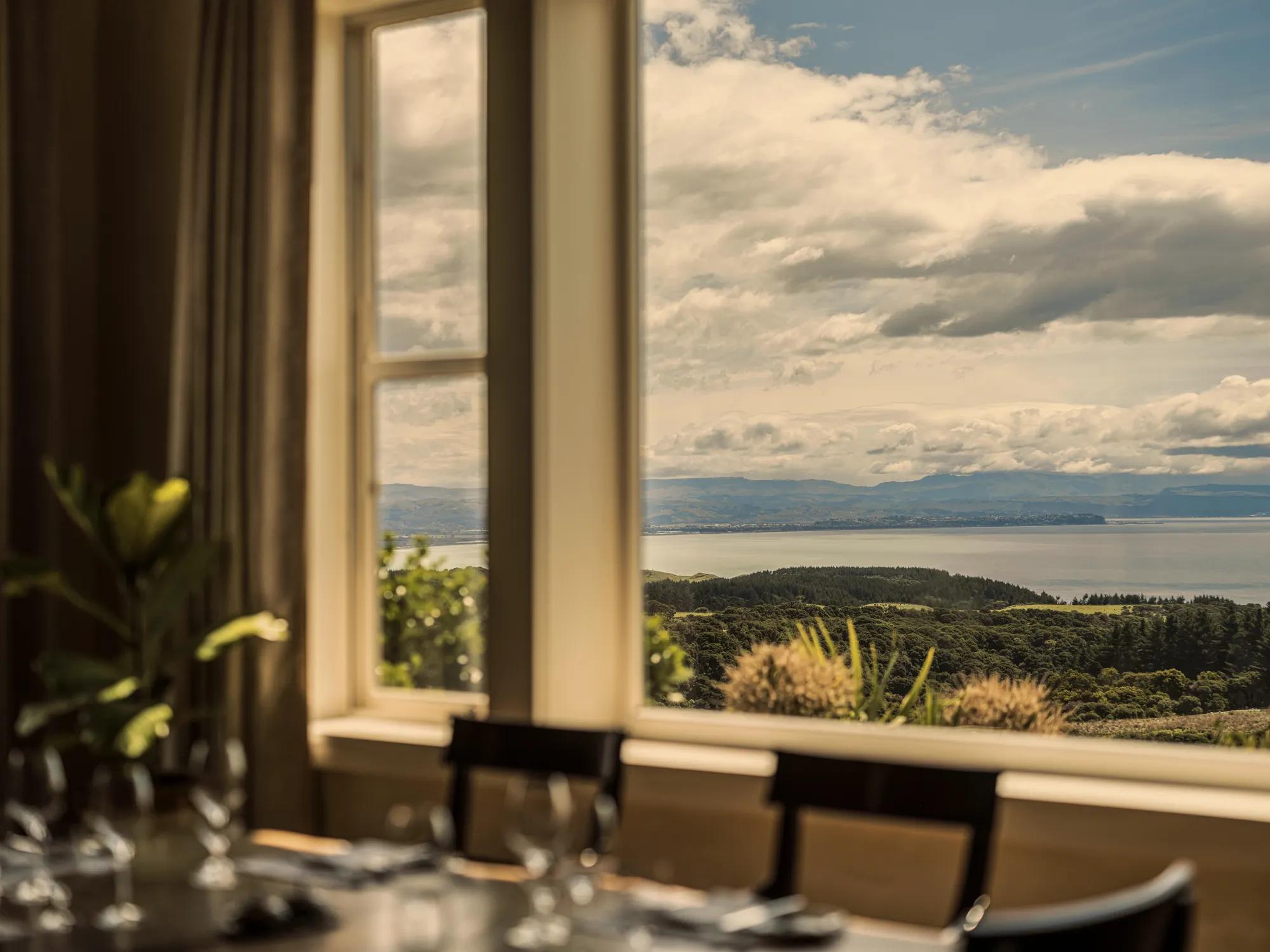 View of the Hawke's Bay out the window of the main dining room at Rosewood Cape Kidnappers