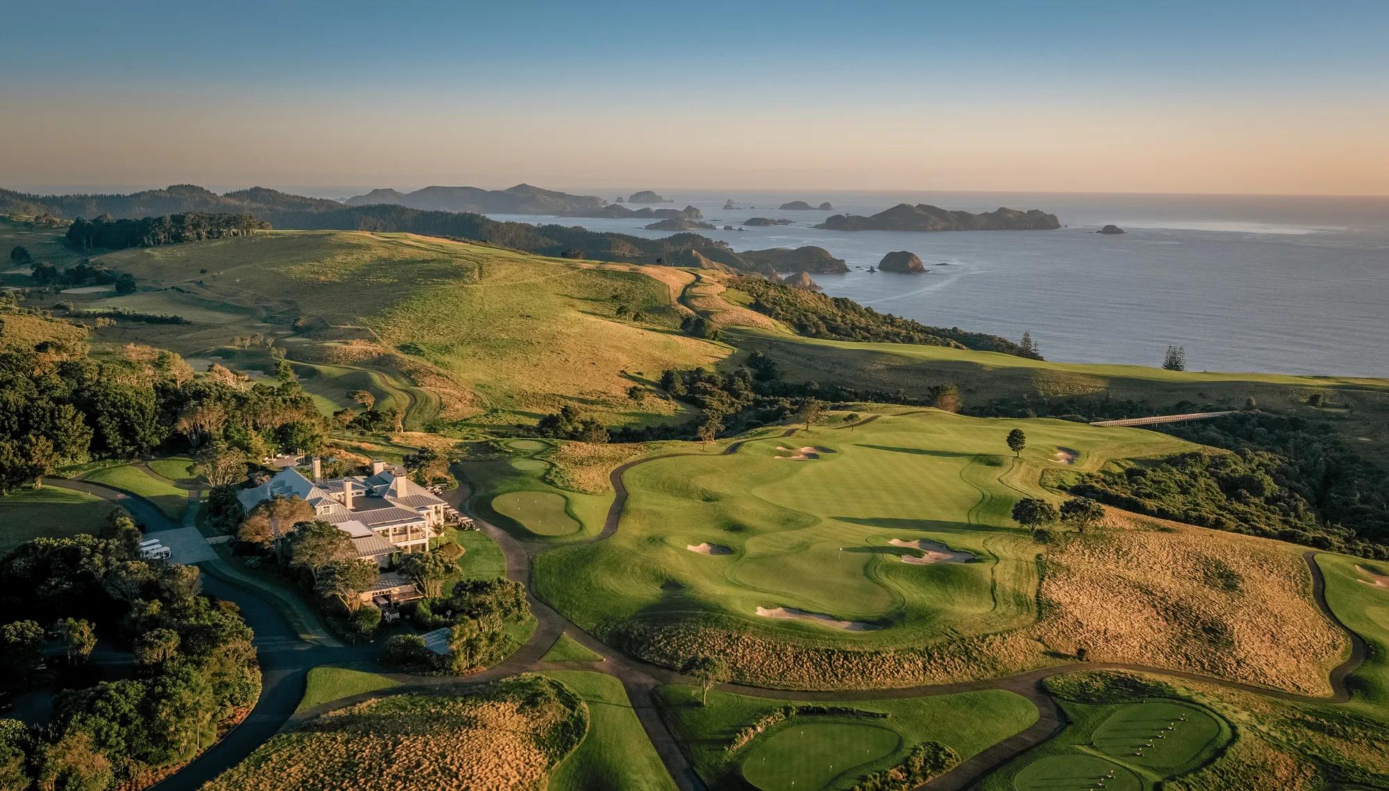 Aerial of the main lodge, Kauri Cliffs Golf Course and the Pacific Ocean.