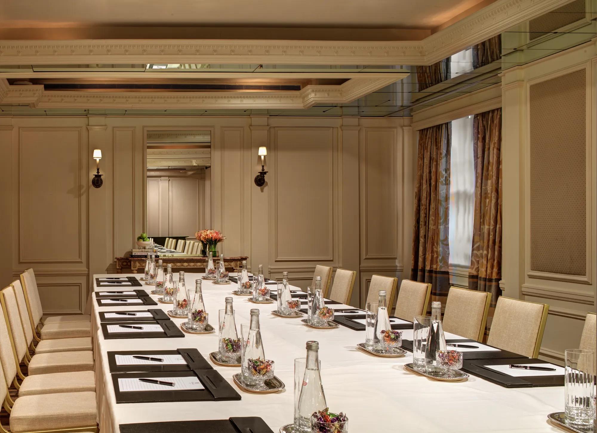 Elegant boardroom at The Carlyle set for a private meeting, with natural light and classic detailing. 