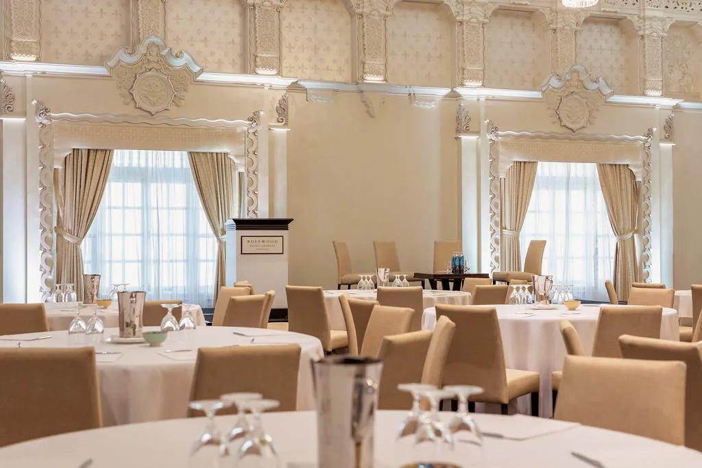 Large Ballroom with long table and chairs with a wedding style decor