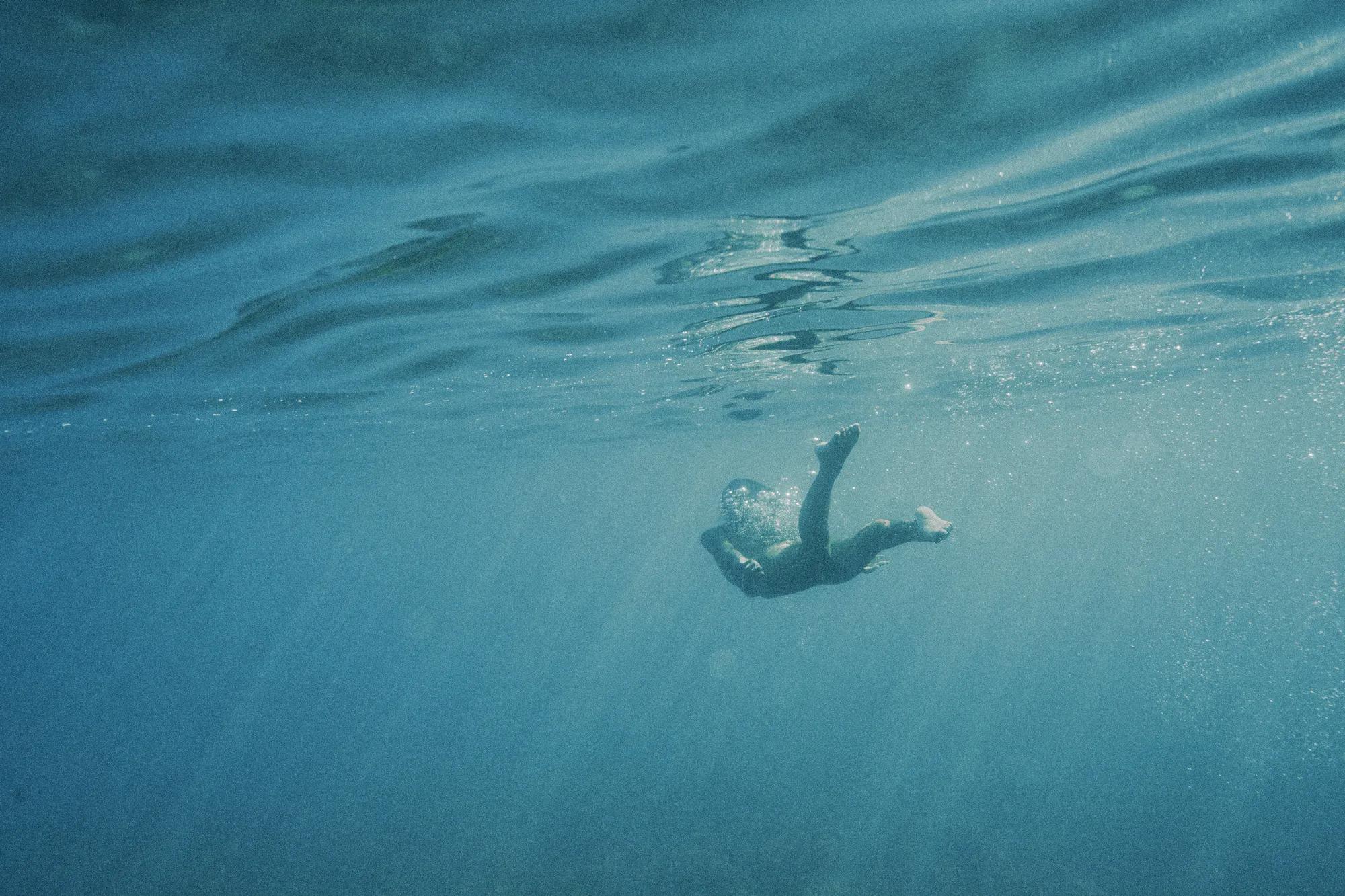 Underwater shot of person swimming 