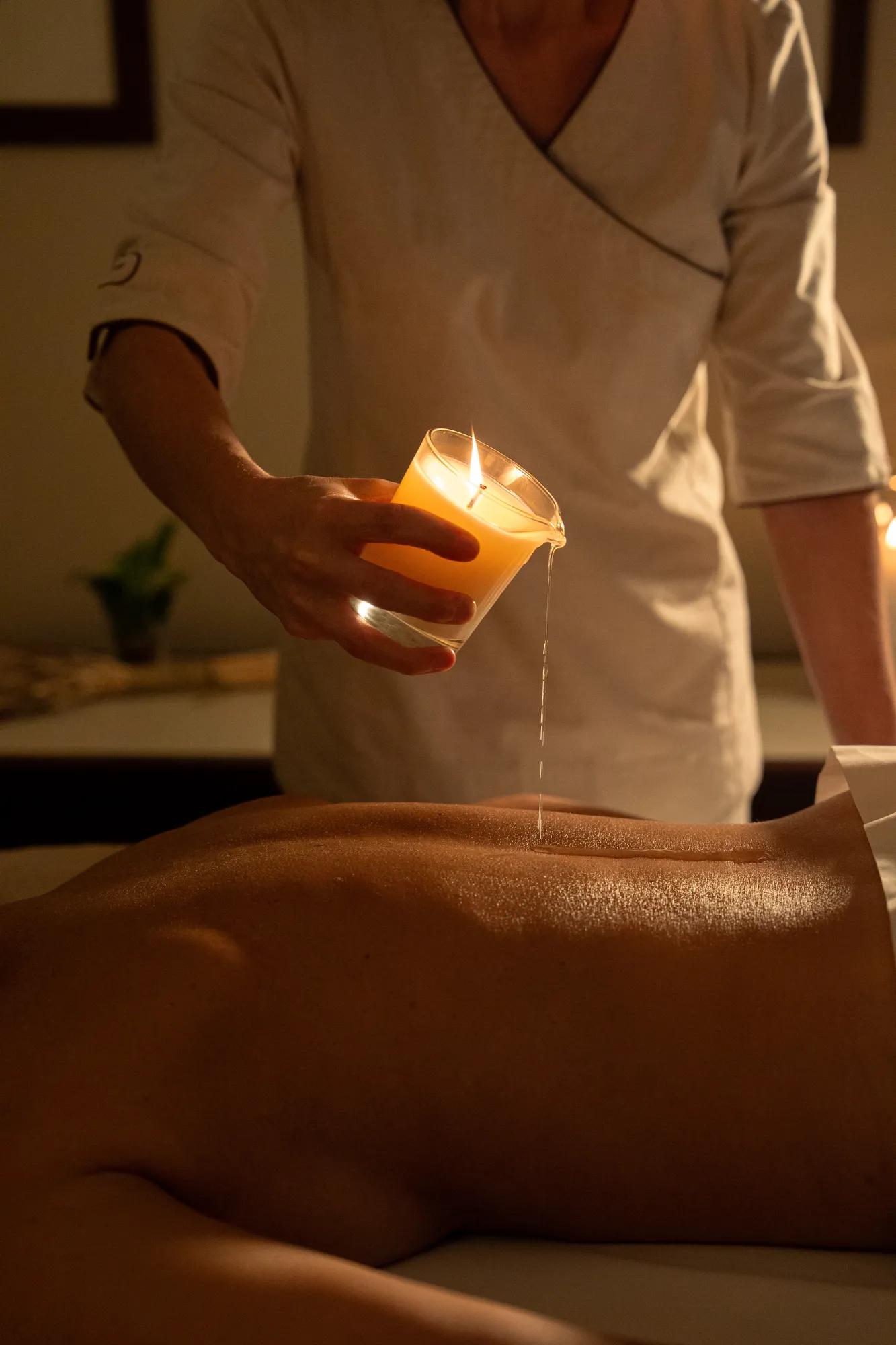 Spa therapist applying warm wax