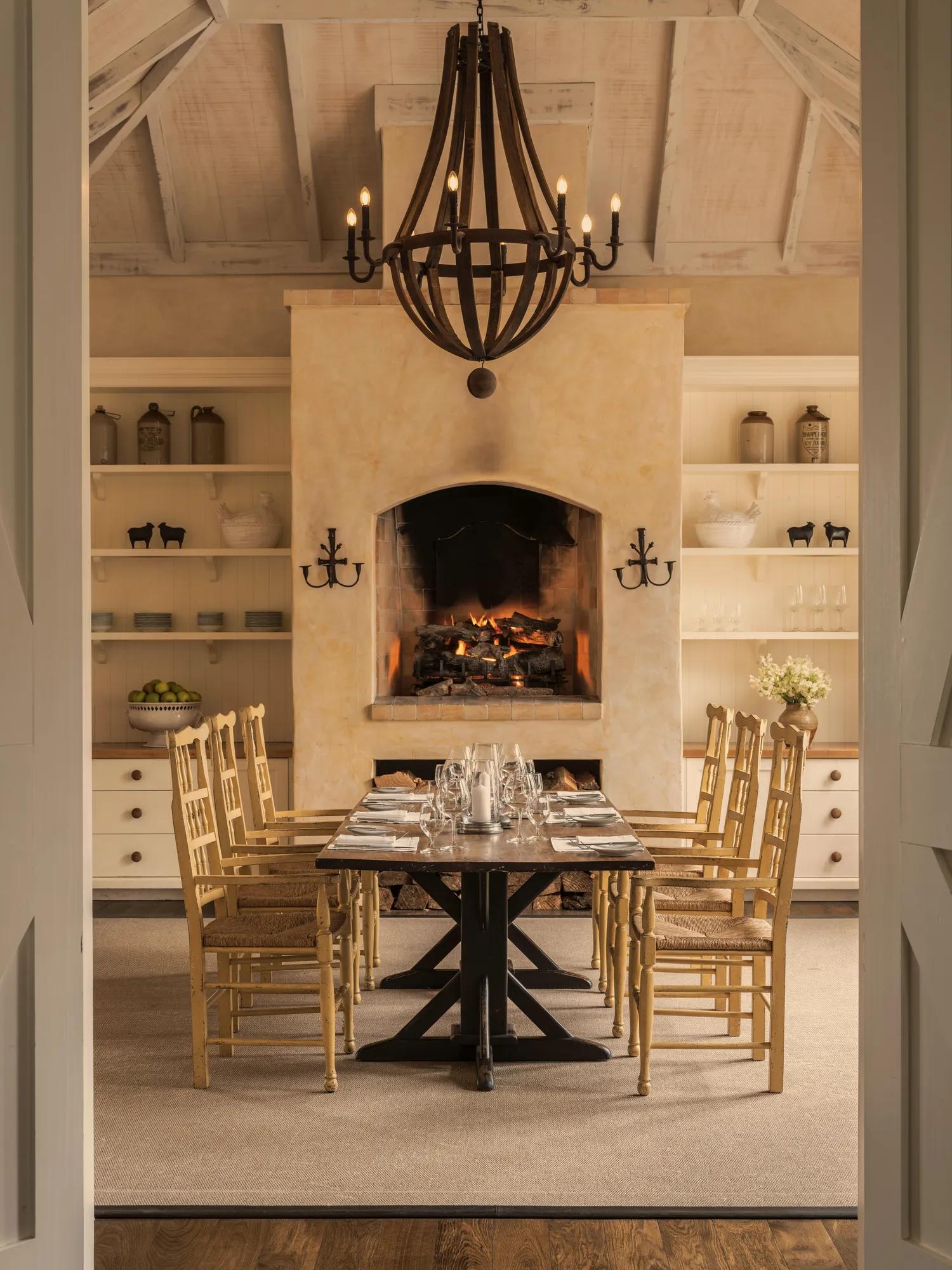 Private dining room at Rosewood Cape Kidnappers with refined countryside interiors and an open fire. 