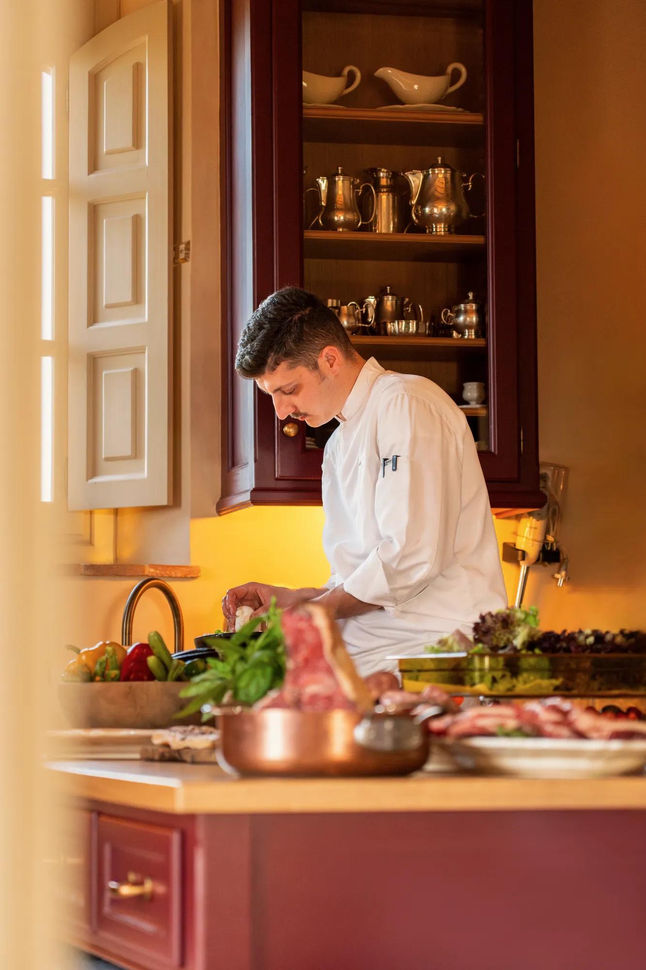 A private chef in a villa, preparing every ingredient for a personalized dinner.