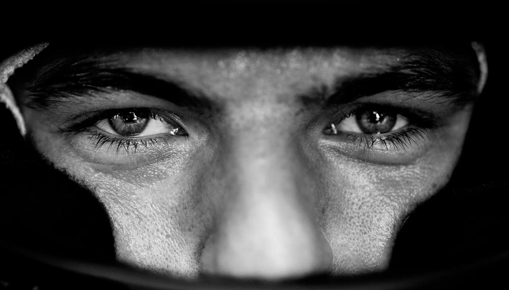 image of max verstappen face with helmet in black and white
